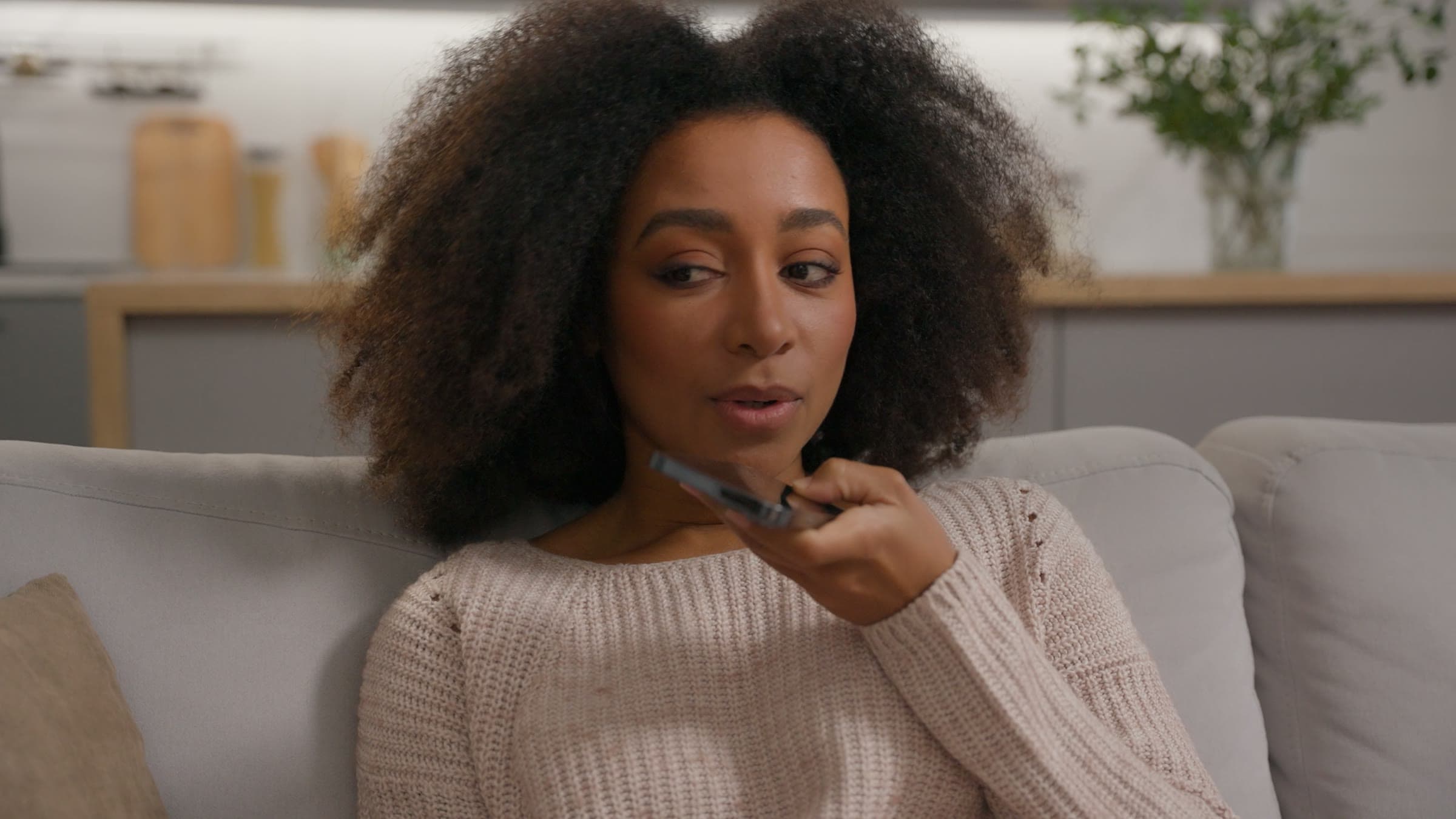 A woman speaking Swahili into her phone